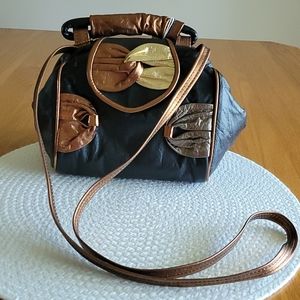 Black and metallic leather handbag
